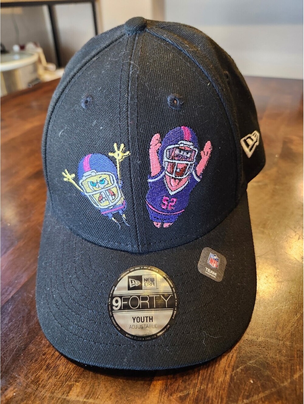 New Era 9FORTY Youth Adjustable Black Baseball Cap with NFL and Cartoon Embroide